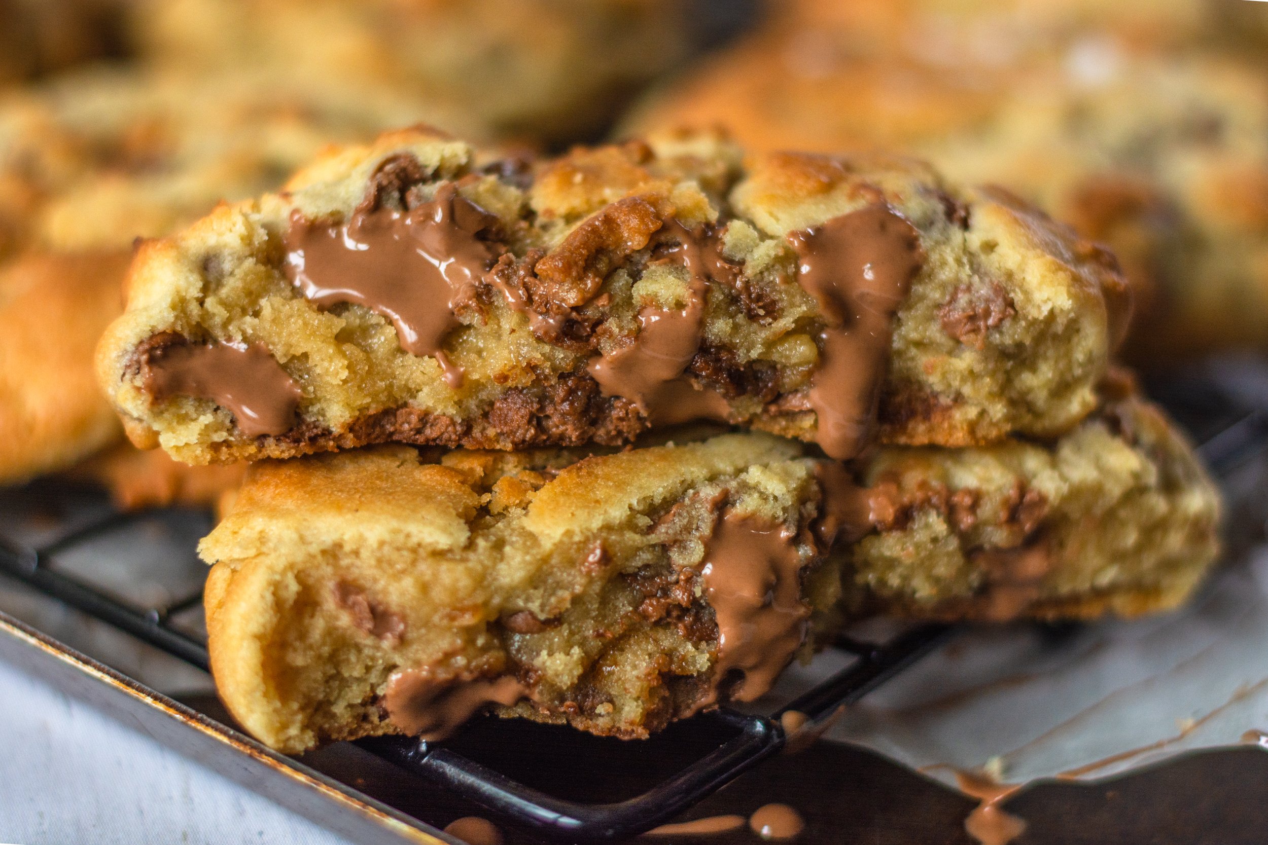 jumbo chocolate chip cookies on a wire rack