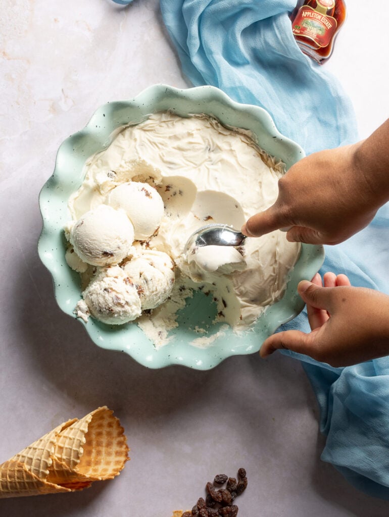 scooping rum & raisin ice cream