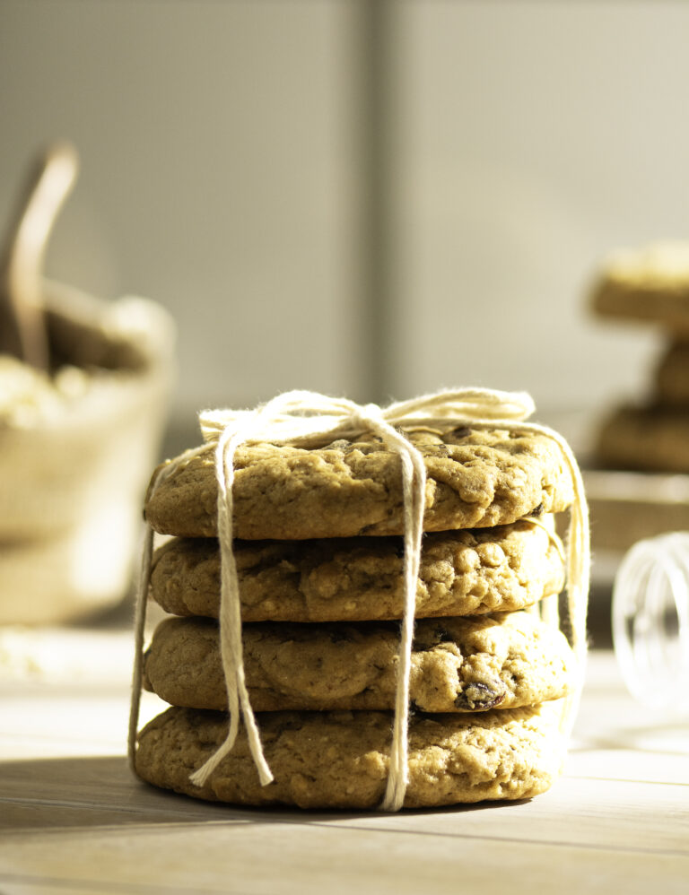 stack of four oatmeal raisin cookies tied with kitchen twine