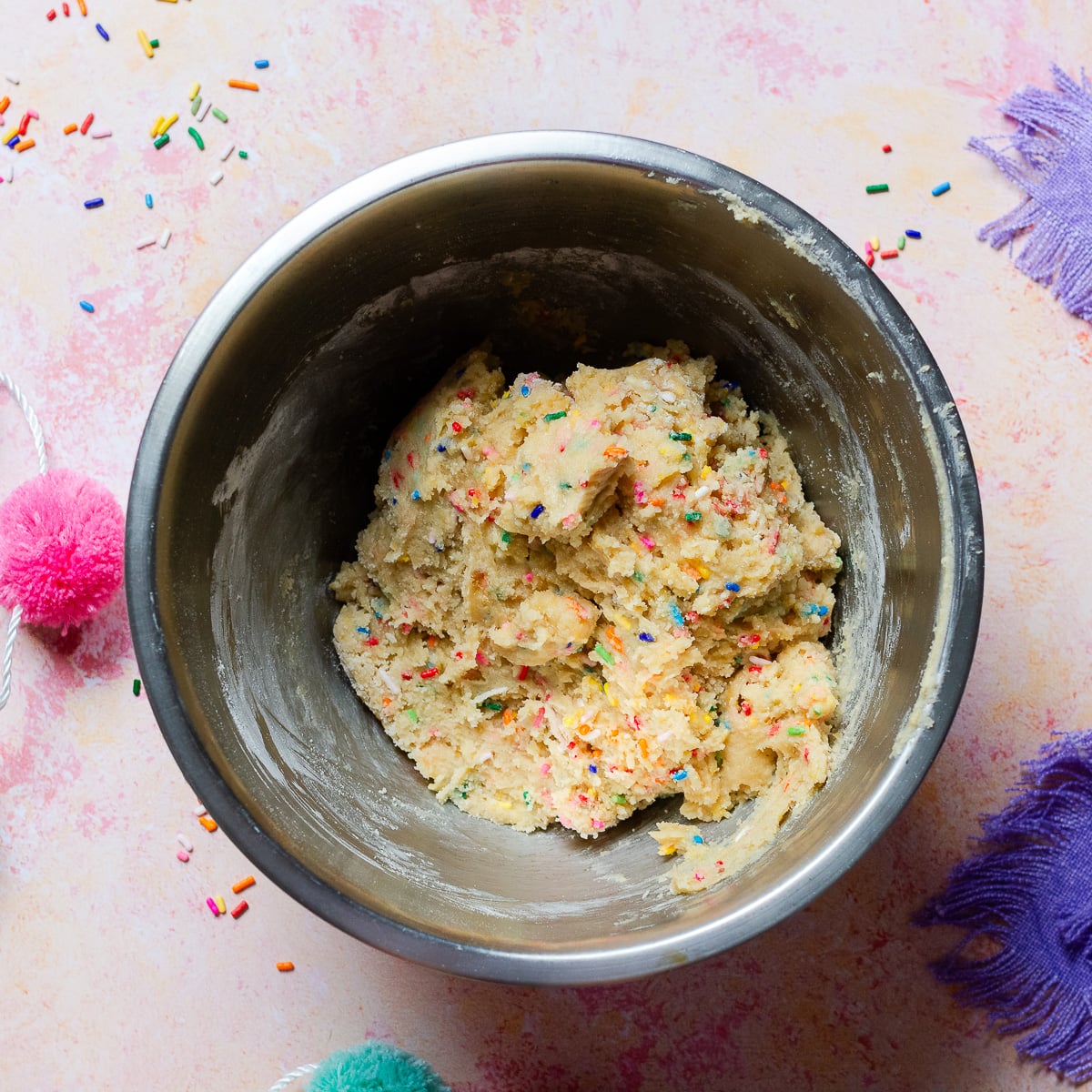 confetti cookie dough in a bowl.