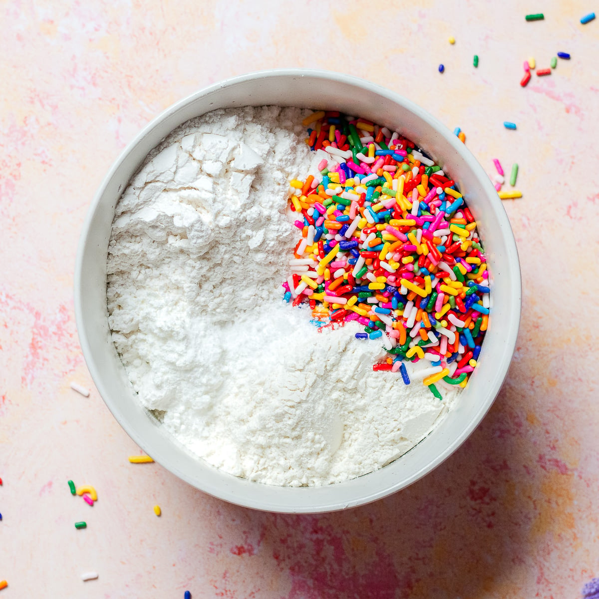 flour and sprinkle jimmies in a bowl.