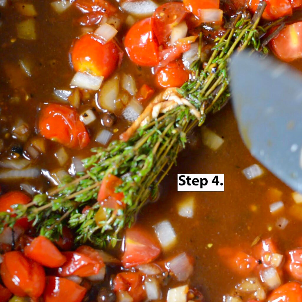 deglazing pan with vegetables and herbs for Jamaican oxtail