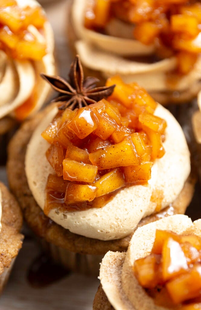 chai-spiced apple pie cupcakes garnished with apple pie topping and one star anise