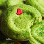 grinch snickerdoodle cookies on a cake stand