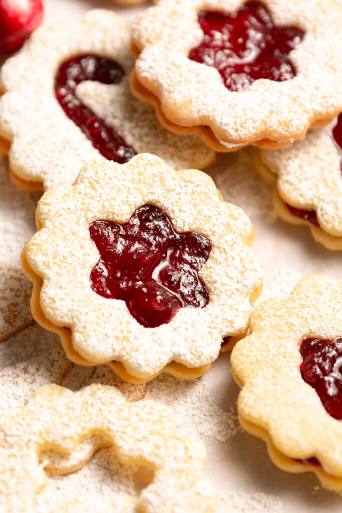 orange cranberry Linzer cookies with dusting of confectioner's sugar