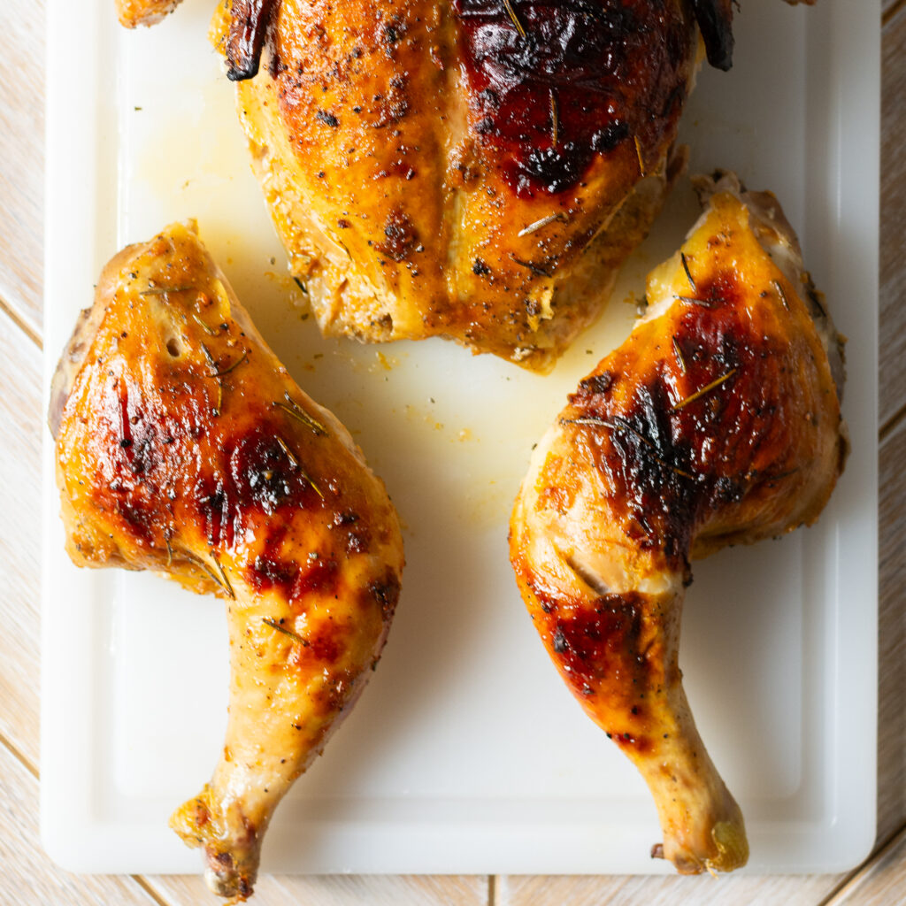 how to break apart a spatchcocked and whole roasted orange maple chicken