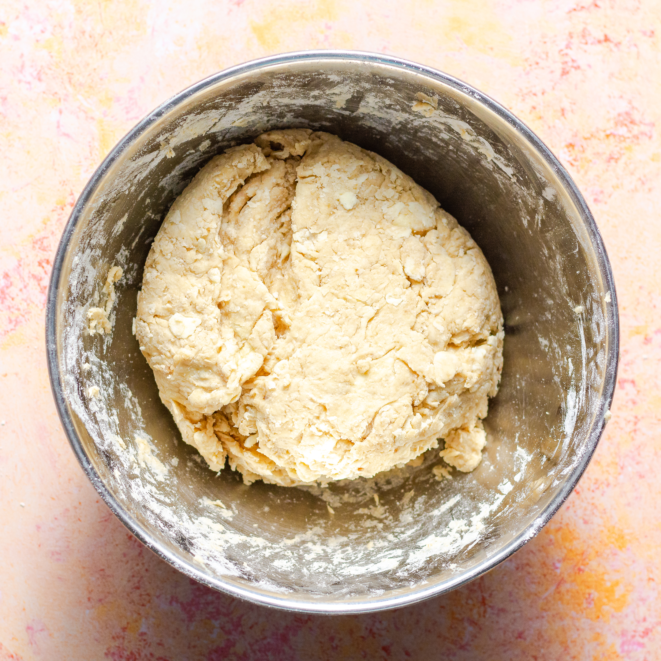 easy buttermilk biscuit dough in a stainless steel bowl.