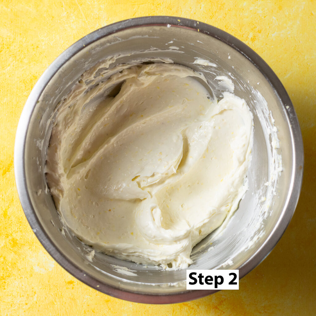 creaming sour cream, cream cheese, sugar and lemon zest