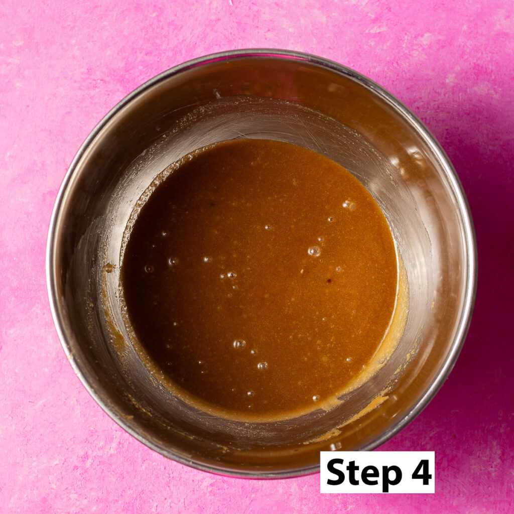 melted butter mixed with granulated and brown sugar in a bowl