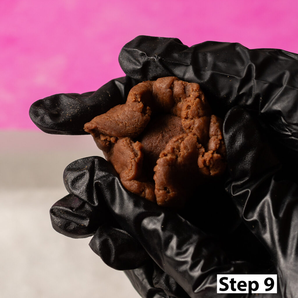 covering chilled chocolate lava filling with chocolate cookie dough