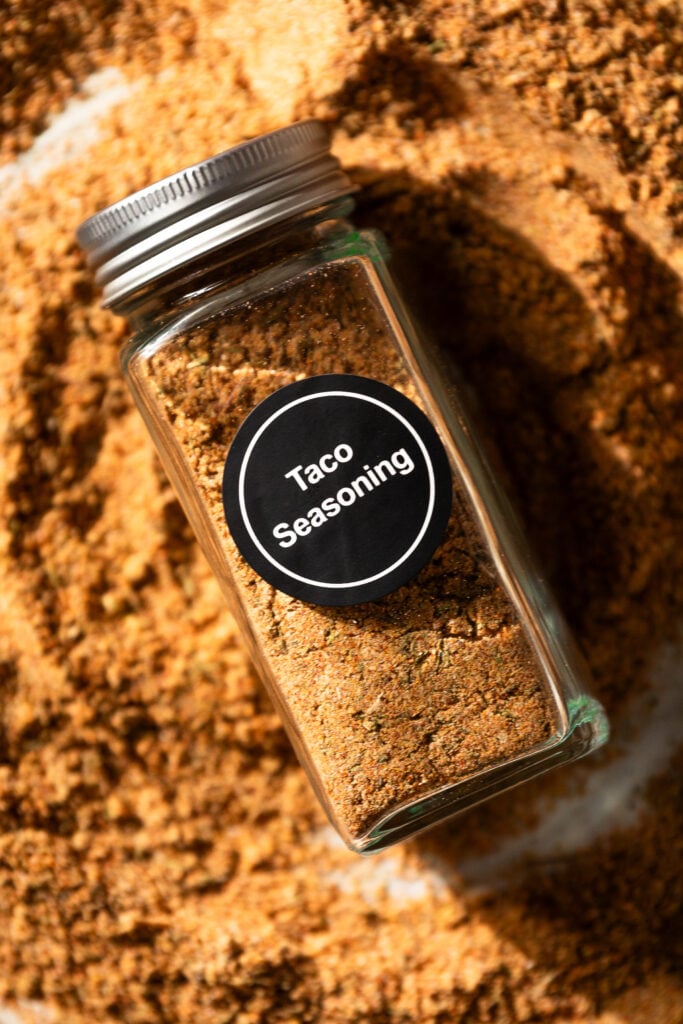 filled spice jar with "taco seasoning" label