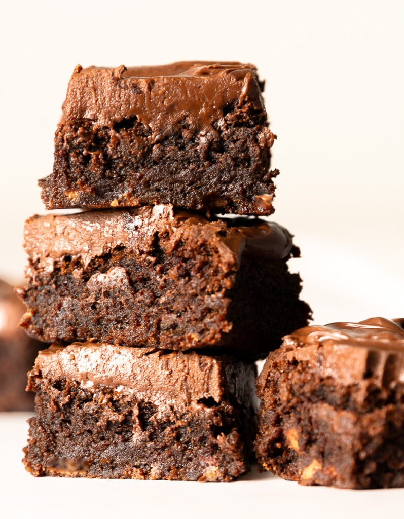 stack of brownies with milk chocolate ganache topping