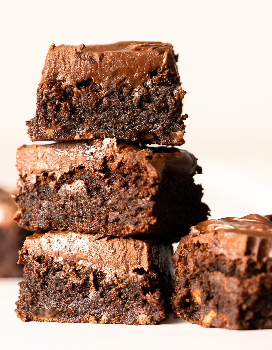 stack of brownies with milk chocolate ganache topping