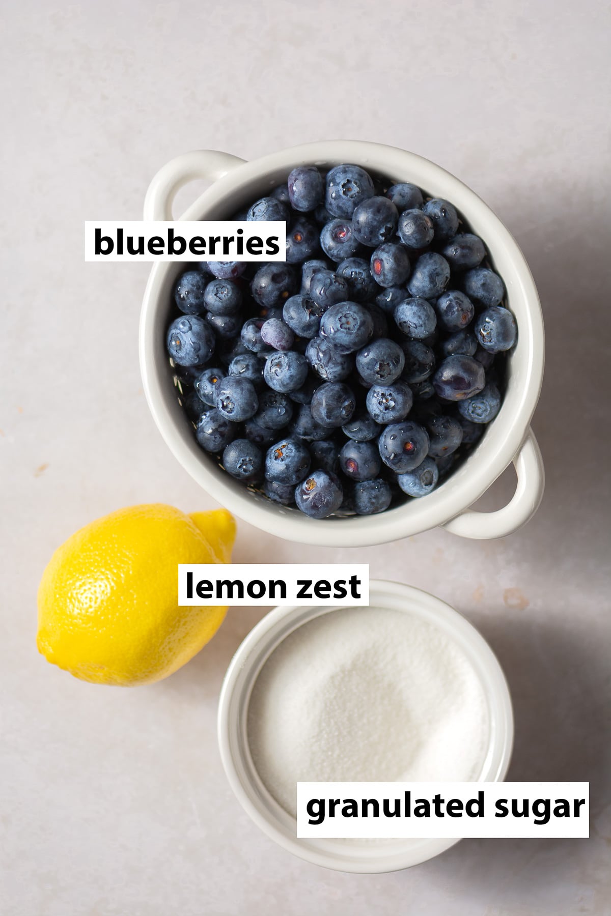 ingredients for easy blueberry compote - blueberries, lemon zest and granulated sugar.