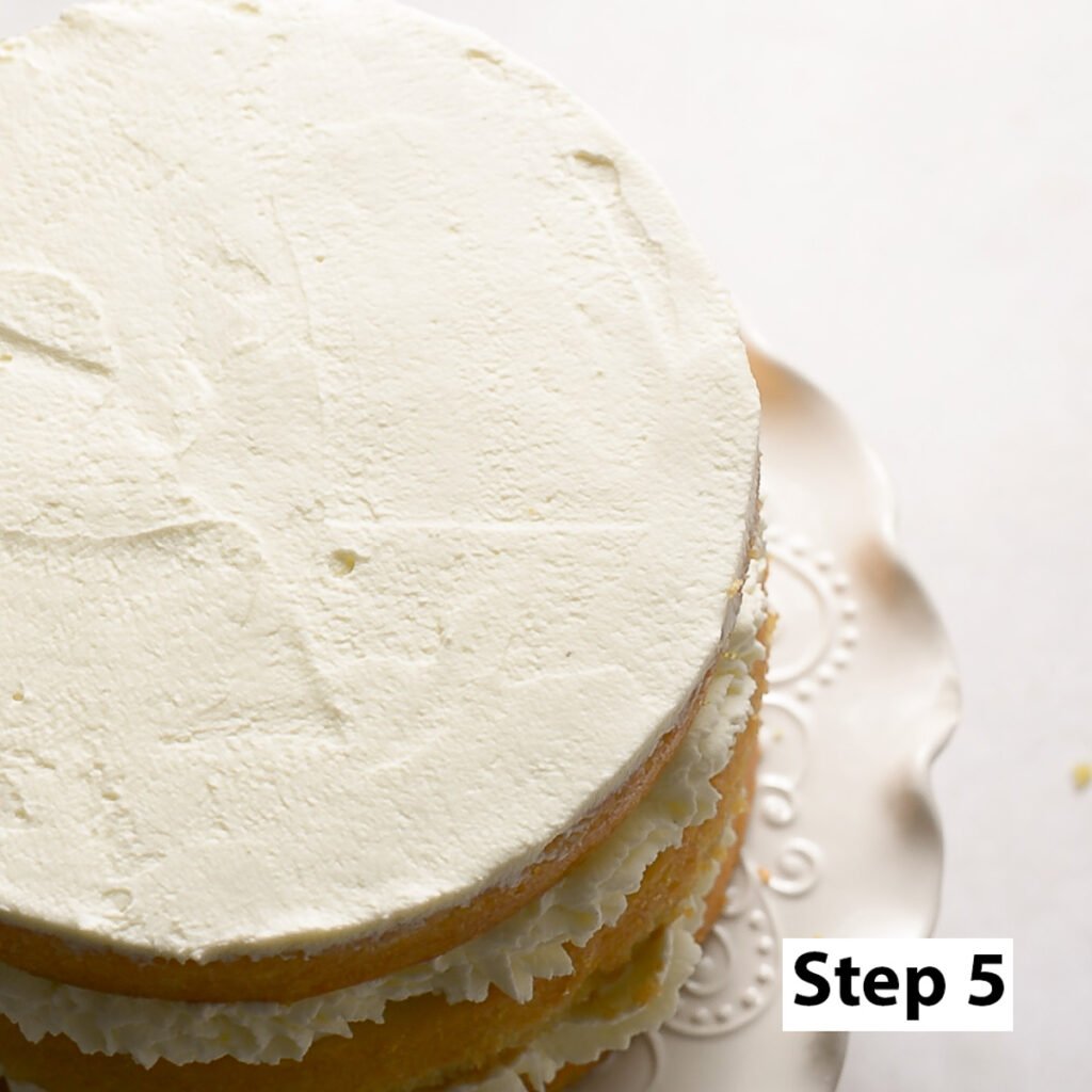 naked layer cake topped with mascarpone whipped cream