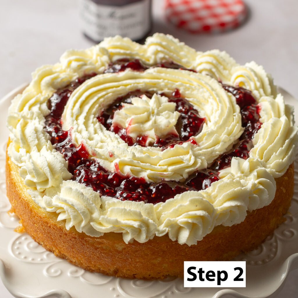 honey lemon cake layered with mascarpone whipped cream and raspberry preserve filling