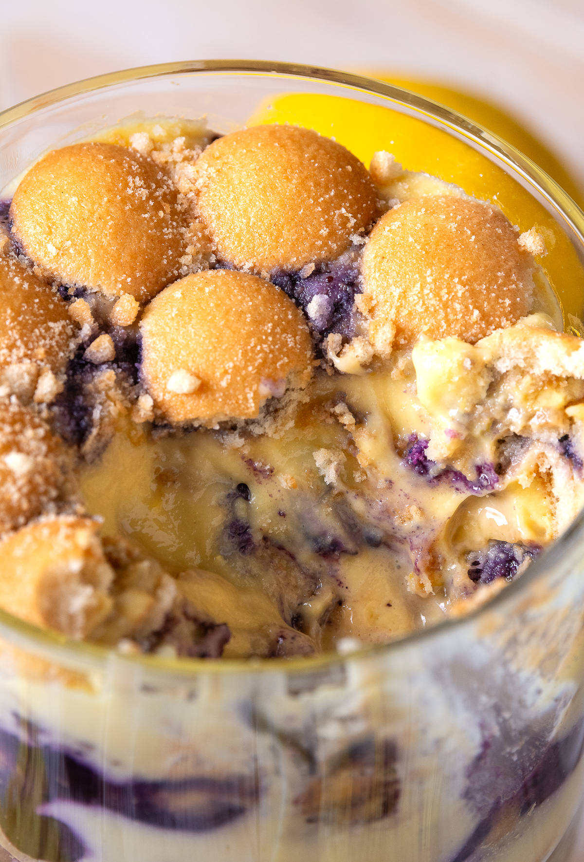 blueberry lemon banana pudding in a trifle dish.