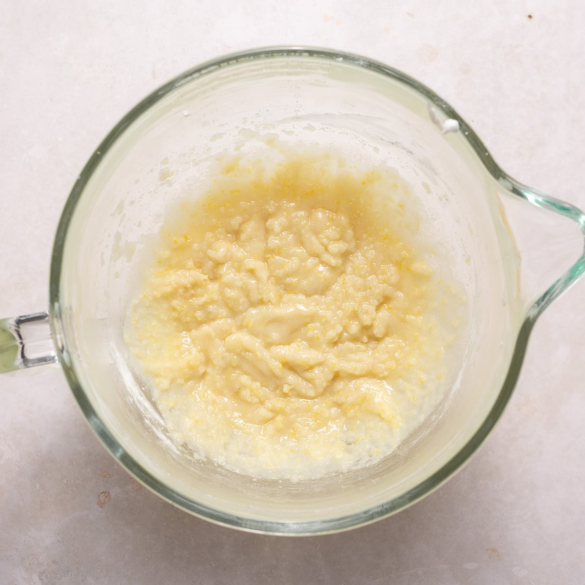 mixing dry ingredients with oil for reverse creaming method.