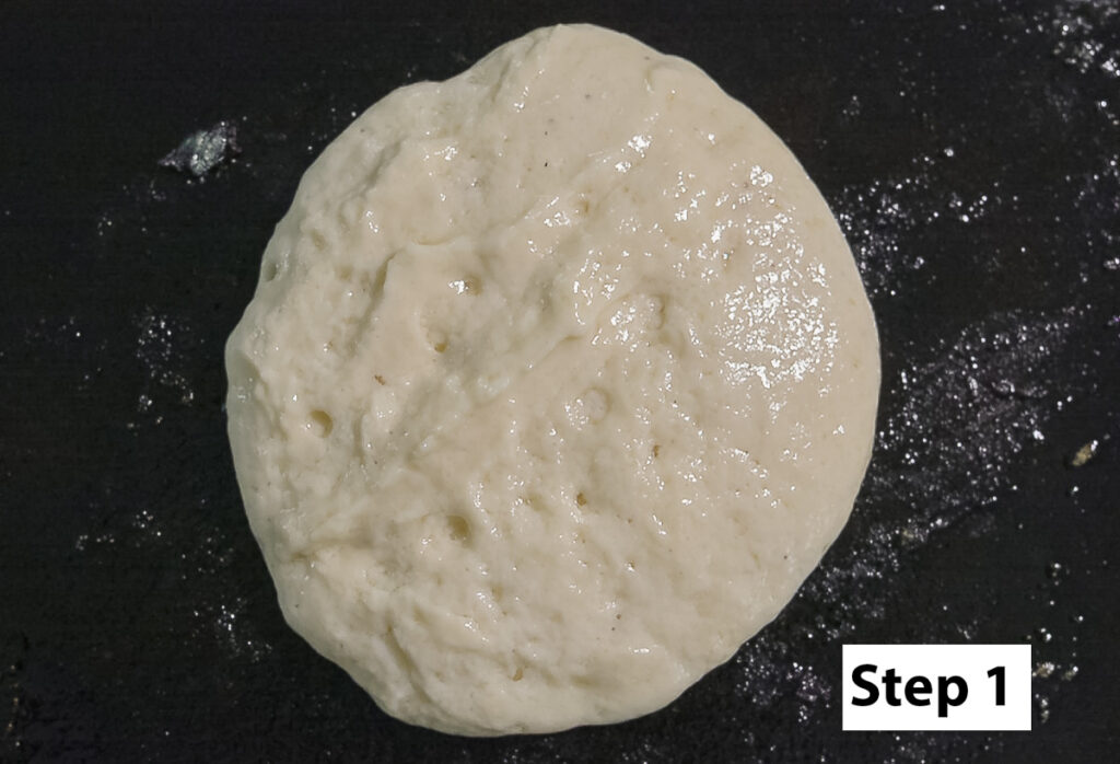 pancake batter on a cast iron griddle