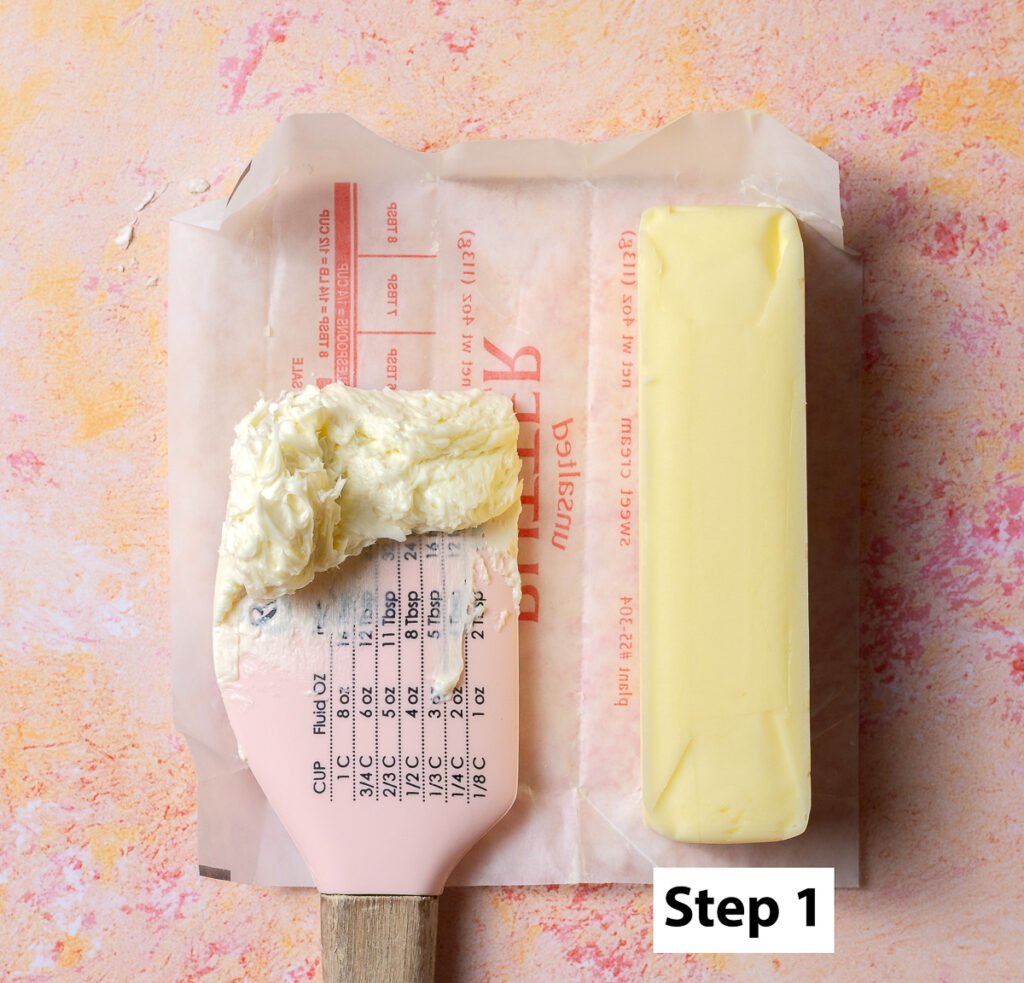 whipped butter on a spatula next to a stick of butter for comparison