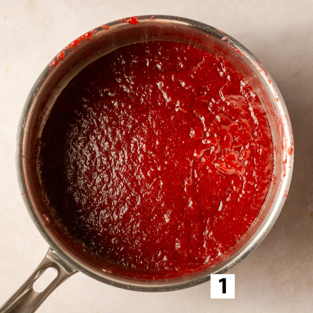 pureed fresh strawberries to fill the triple strawberry layer cake after being reduced