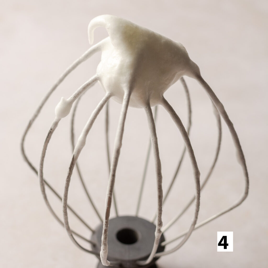 ehh whites whipped to soft peaks on a whisk