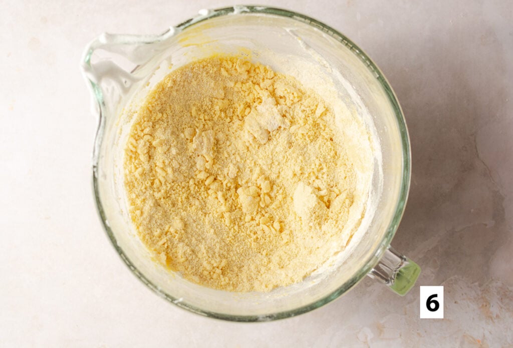 dry ingredients added to whipped egg yolks for a fresh strawberry cake
