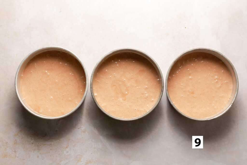 strawberry cake batter in three 8-inch cake pans