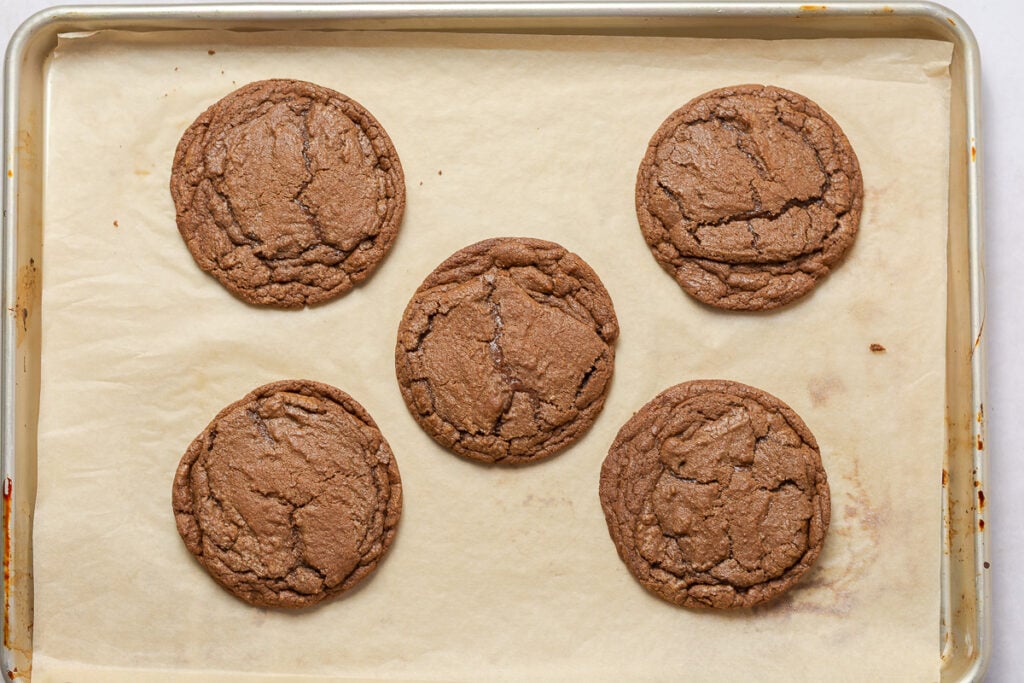 chocolate cookies on a parchment lined baking tray