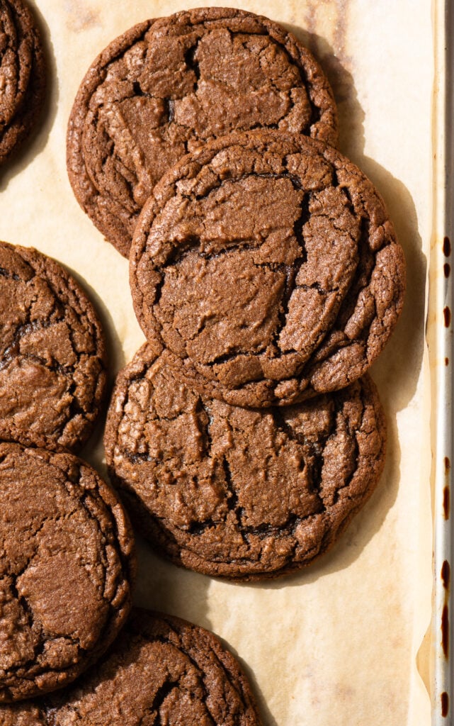 chocolate cookies on a parchment lined baking tray