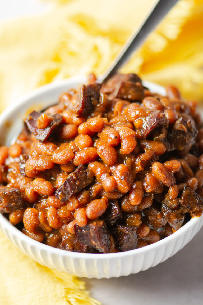maple barbecue baked beans in a bowl with a spoon