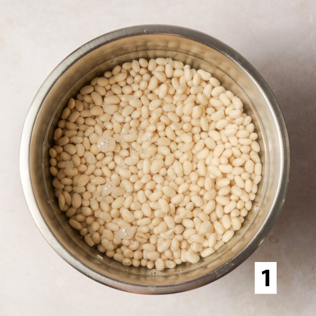 soaked navy beans in a bowl
