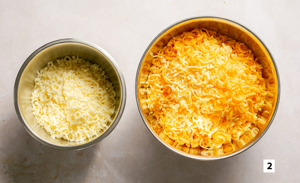bowl of grated mozzarella & bowl of grated medium cheddar and gouda cheese