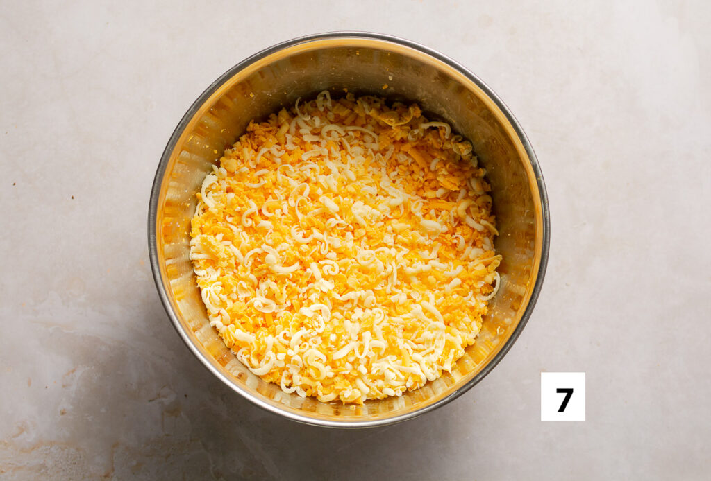 bowl of shredded mozzarella, medium cheddar & gouda cheese