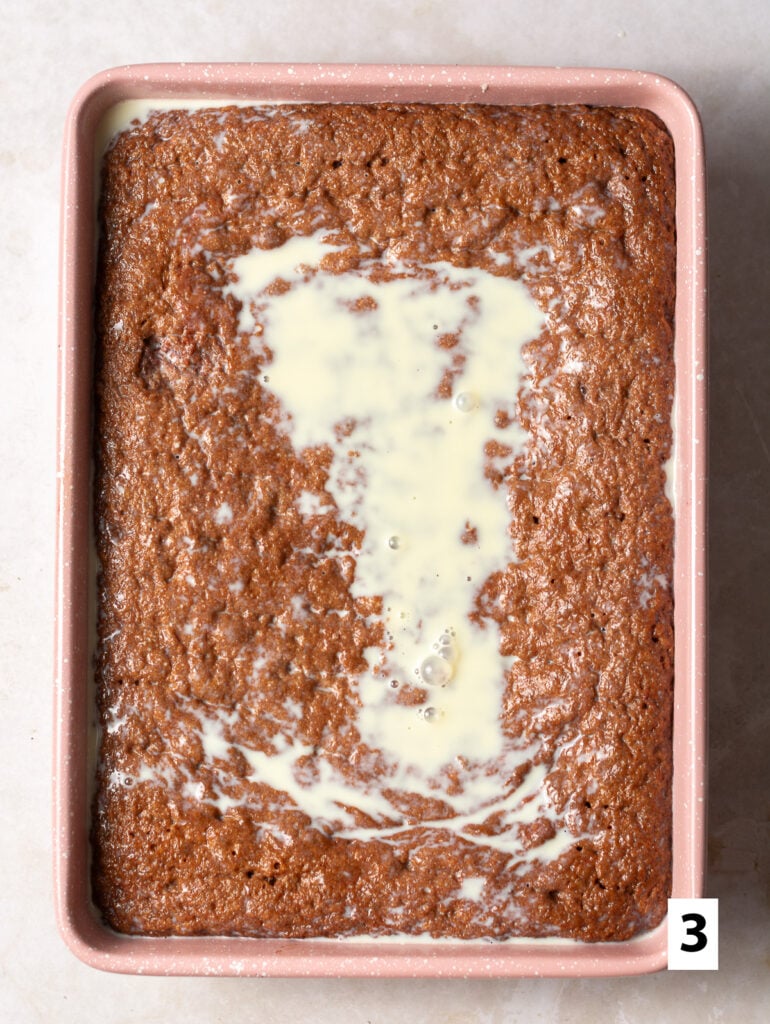 tres leches milk mixture soaking into red velvet sponge cake