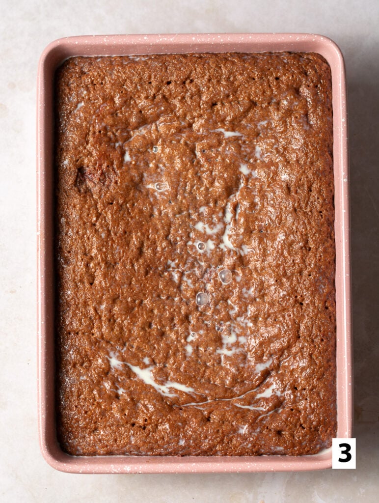 tres leches milk mixture soaking into red velvet sponge cake