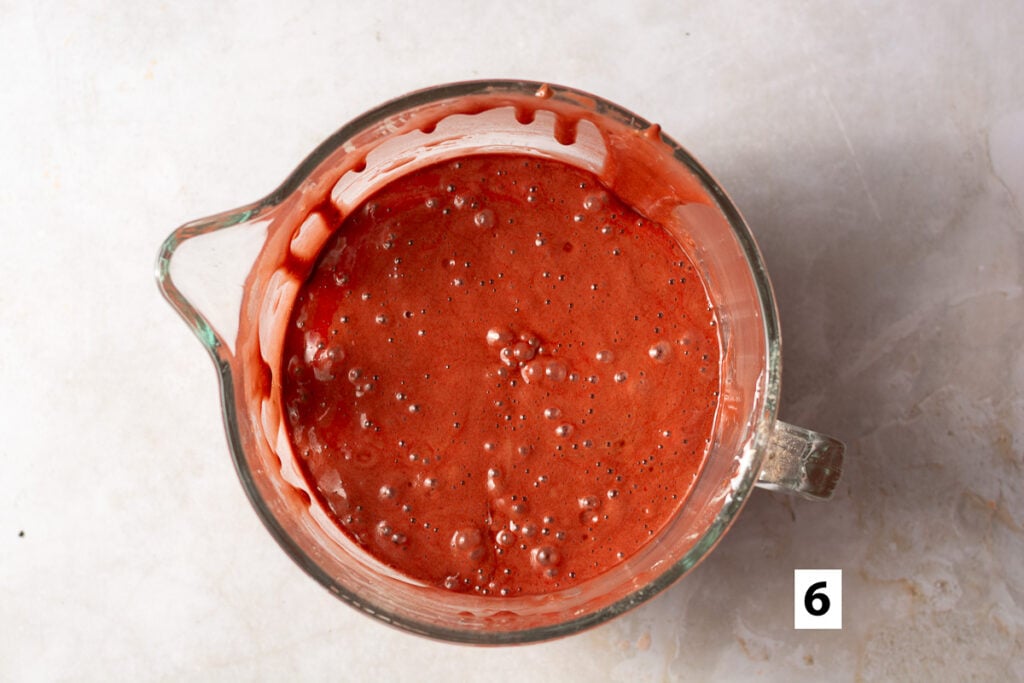 red velvet sponge cake batter in a glass bowl