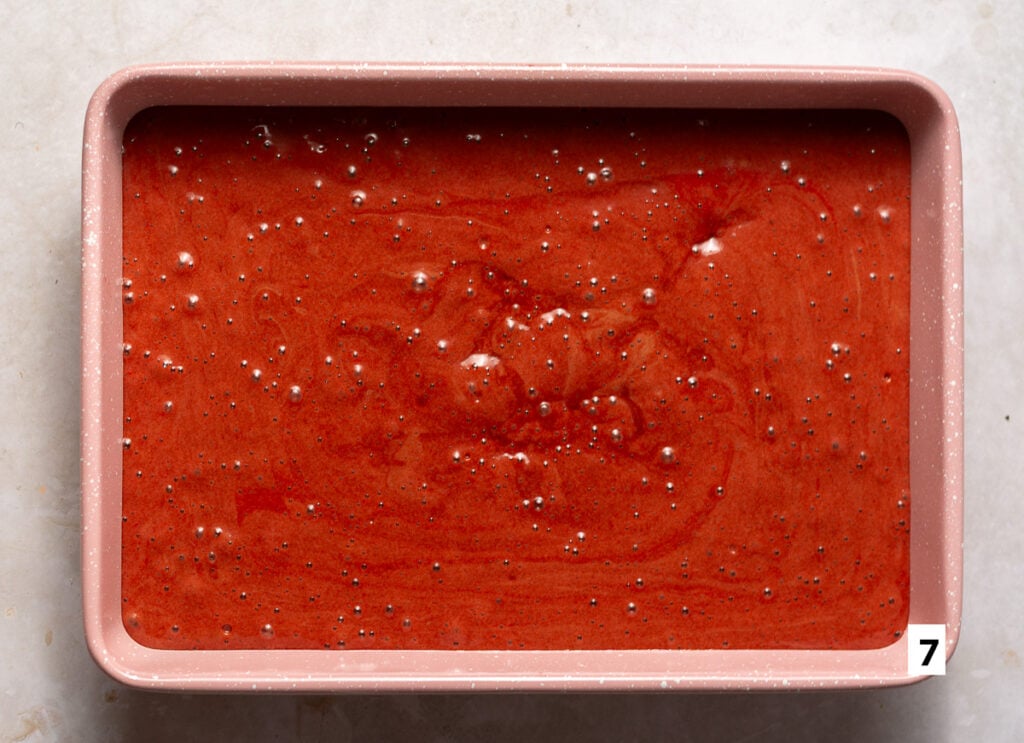 red velvet cake batter in a 9x13 inch baking pan