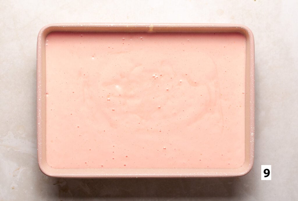 strawberry cake batter in a 9x13 inch cake pan