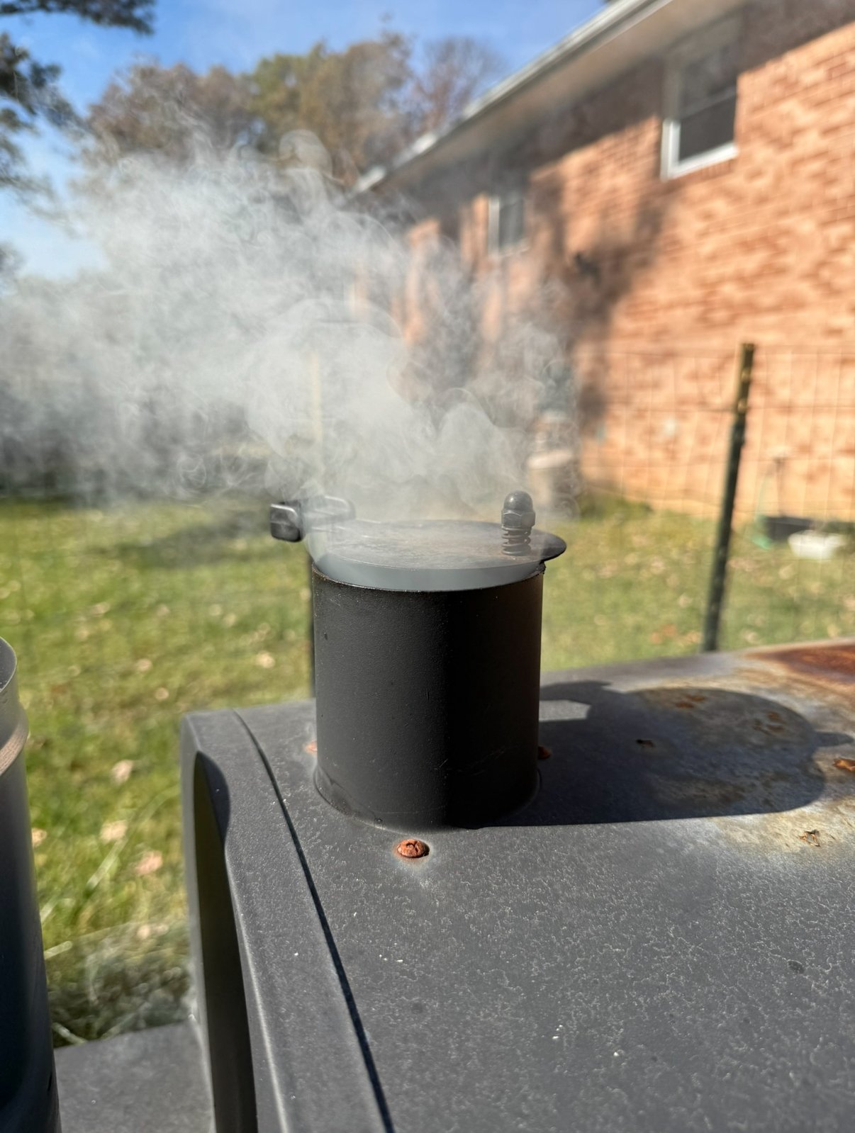 thick white smoke (bad smoke) coming from grill chimney