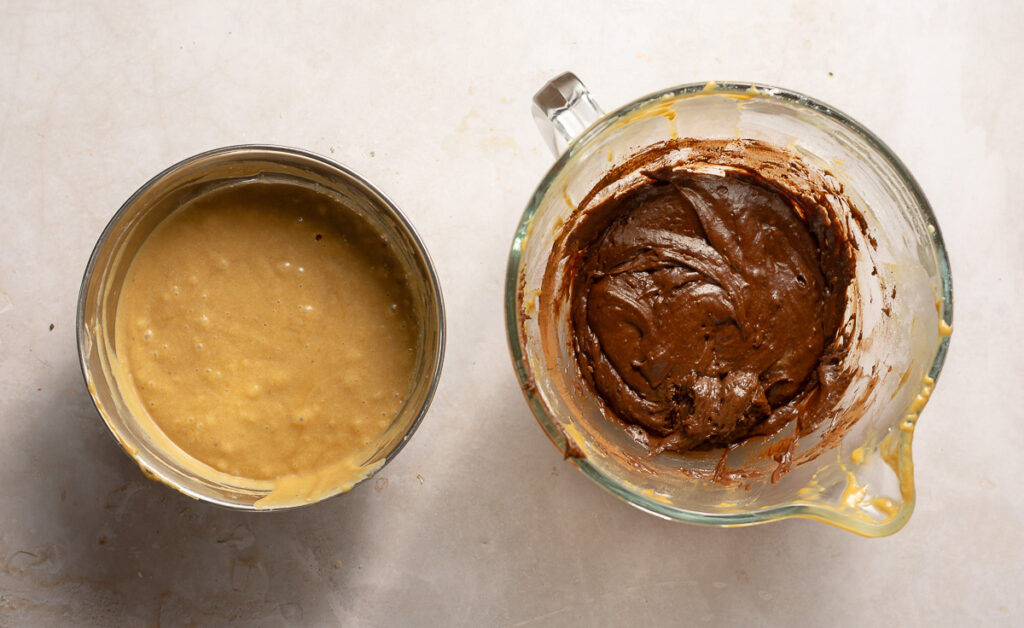 banana and chocolate cake batter in separate bowls
