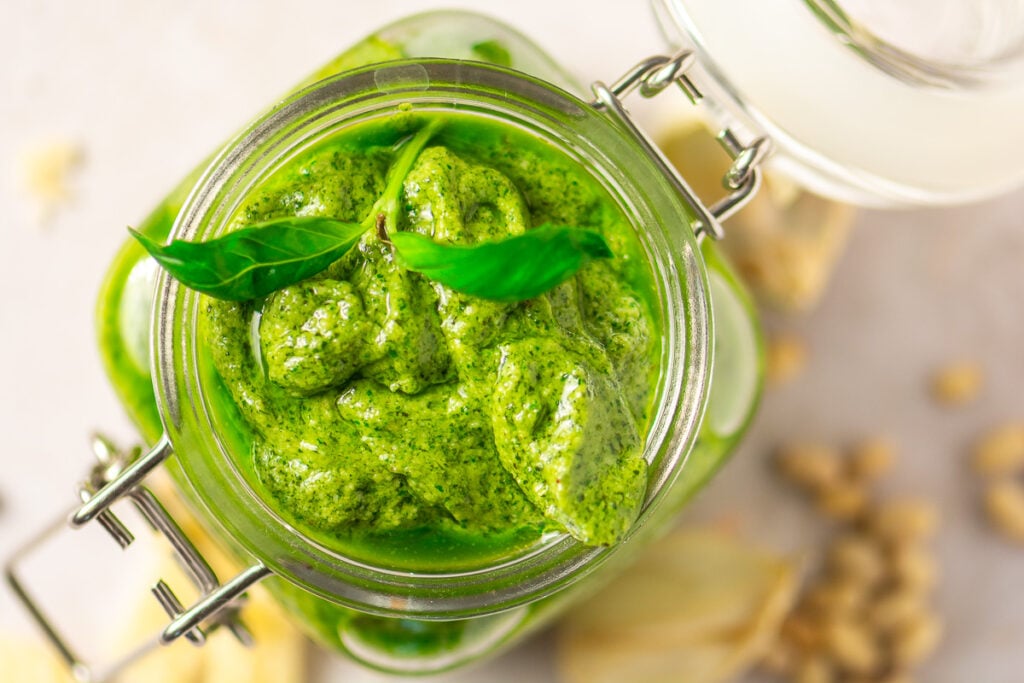 classic basil pesto in a glass jar