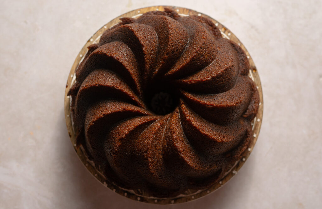 chocolate banana marble bundt cake on a cake stand