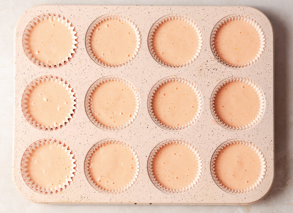 strawberry cupcake batter in a standard 12-muffin pan