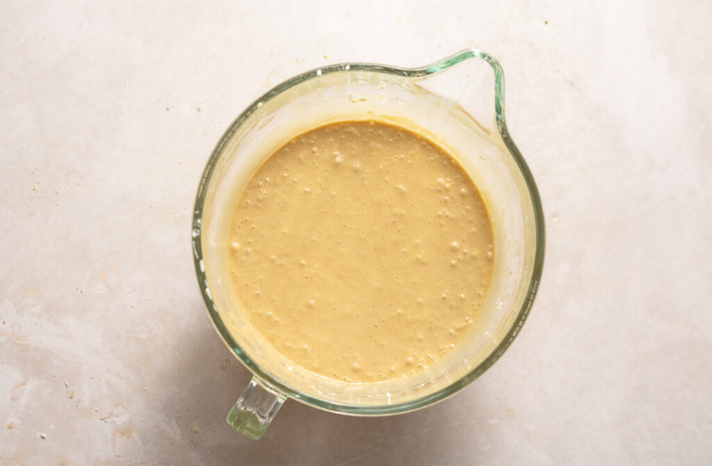 whipped eggs in a glass bowl