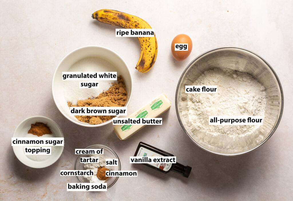 ingredients for brown butter banana snickerdoodle cookies - ripe banana, egg, all-purpose flour, cake flour, unsalted butter, vanilla extract, granulated sugar, dark brown sugar, cinnamon, cornstarch, cream of tartar, salt & baking soda