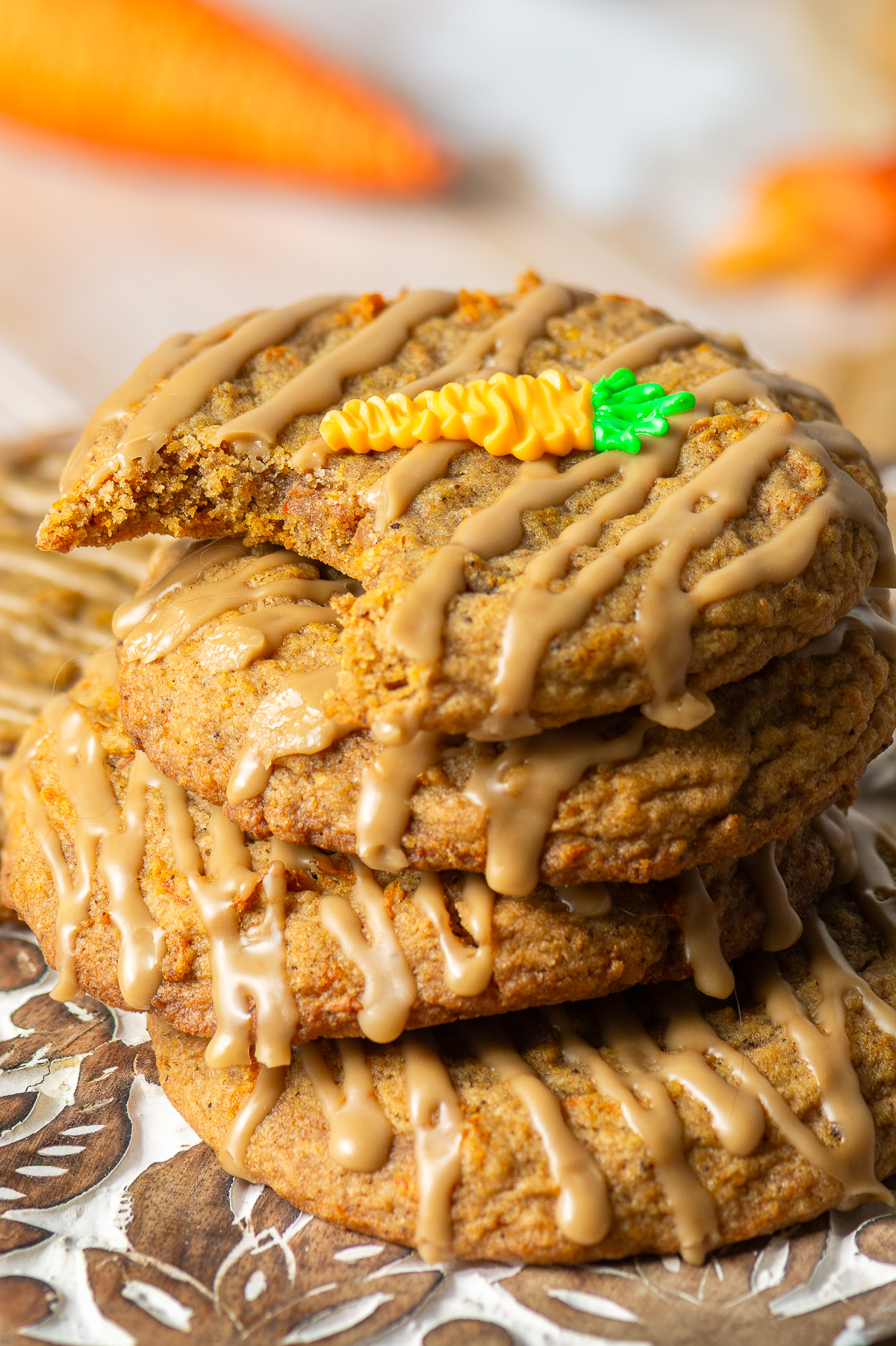 carrot cake cookies with brown sugar glaze and royal icing carrot decoration
