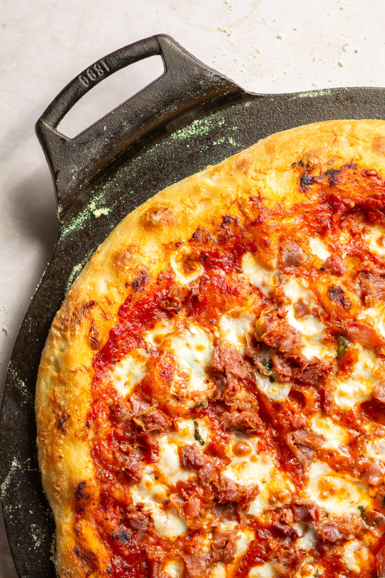 homemade pizza on a cast iron pan