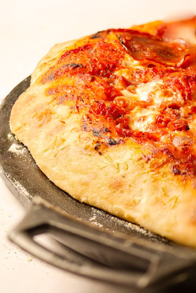homemade pizza on a cast iron pan