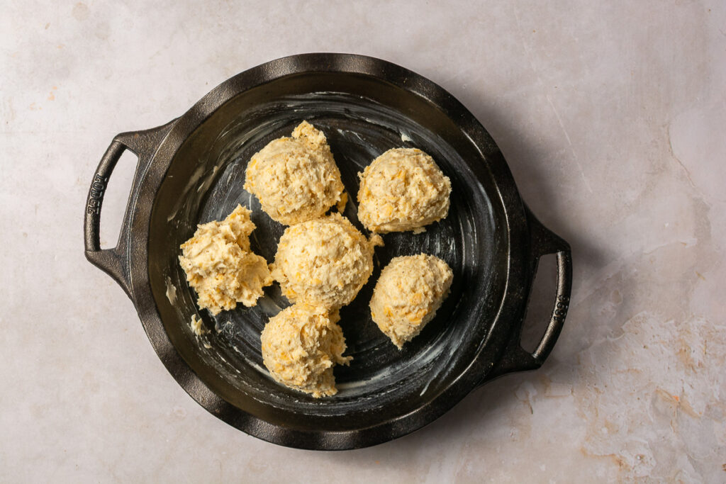 biscuit dough in a greased cast iron skillet